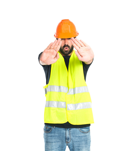 Workman faisant stop signe sur fond blanc
 - Photo, image