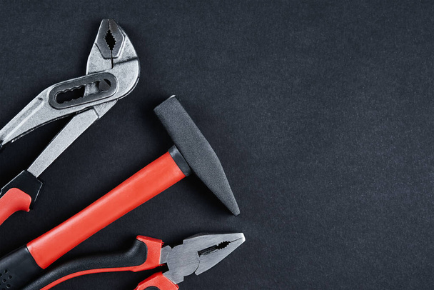 Set of tools for repair and maintenance on black background - Photo, Image