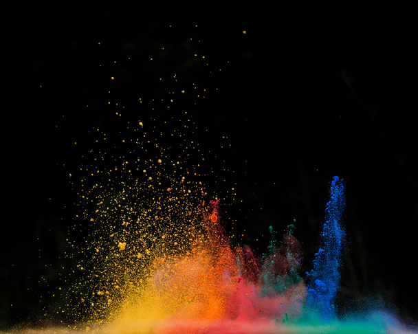 colored dust explosion on black background - 写真・画像