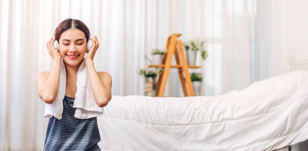 Portrait of smiling cheerful beautiful pretty asian woman clean fresh healthy white skin posing in pajamas clothes.Girl felling relaxing and enjoy time on the bed at home.asia beauty - Photo, Image