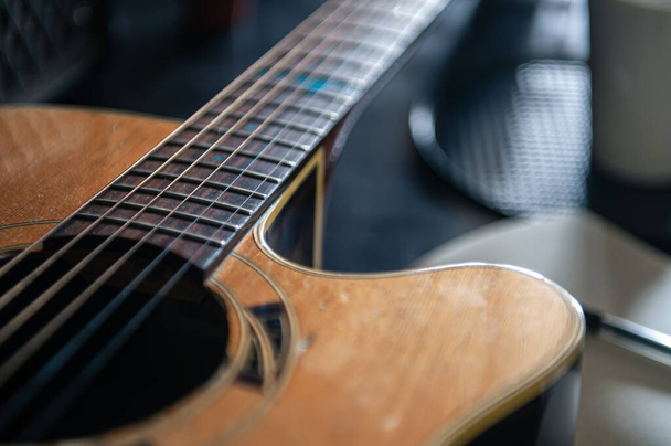 Close up, wooden acoustic guitar, musical creativity concept. - Zdjęcie, obraz