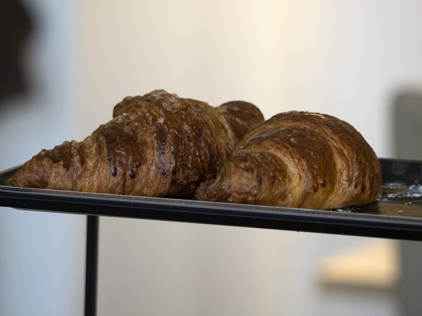 fresh french croissant for hotel breakfast detail close up - Foto, afbeelding