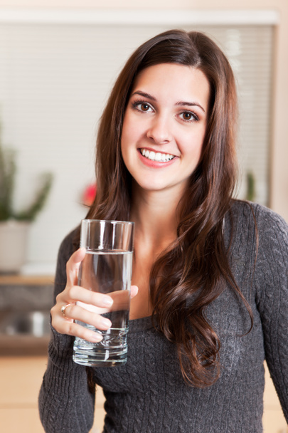 Woman holding glass of water - Photo, Image