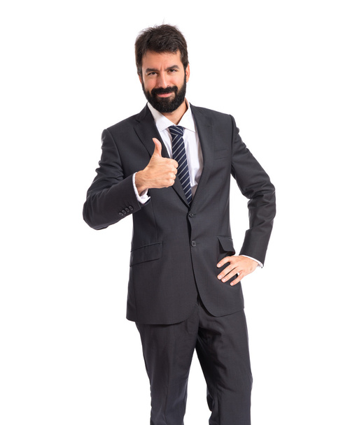 Businessman with thumb up over white background - Photo, image