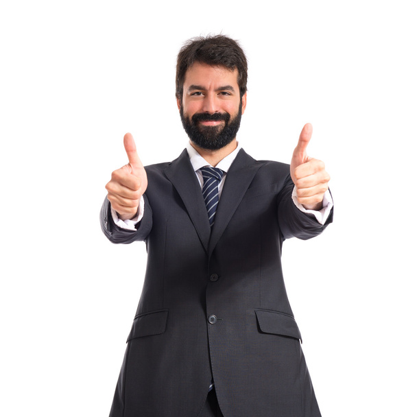 Businessman with thumb up over white background - Fotoğraf, Görsel
