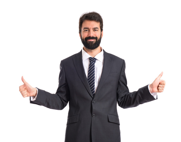 Businessman with thumb up over white background - Φωτογραφία, εικόνα
