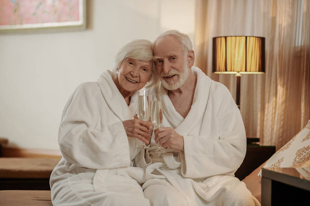 A senior couple celebrating their marriage anniversary and looking happy - 写真・画像
