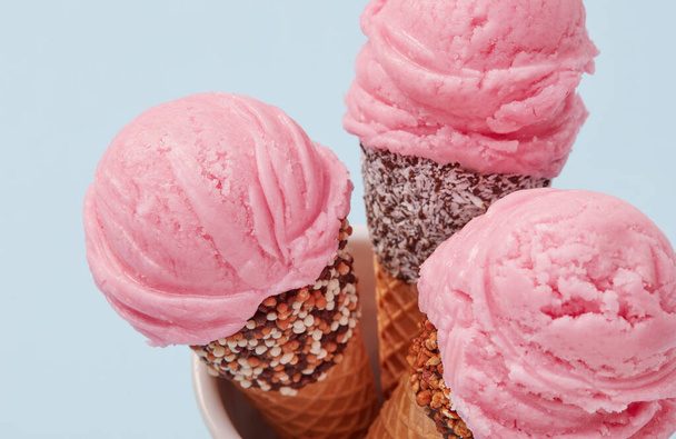 Ice cream cones on blue background - Photo, Image