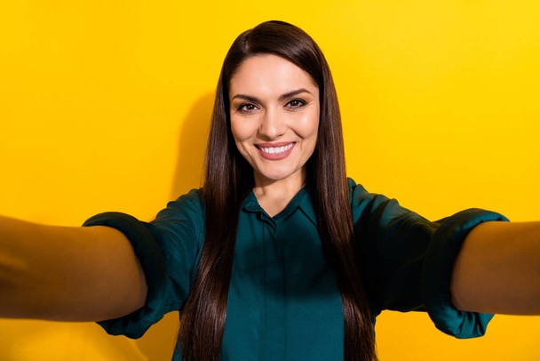 Photo of young lovely woman make take selfie photographer trip isolated over yellow color background - Foto, imagen