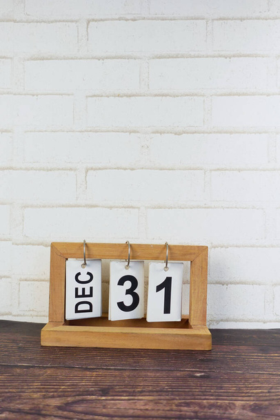 wooden calendar set on the 31 of December. - 写真・画像