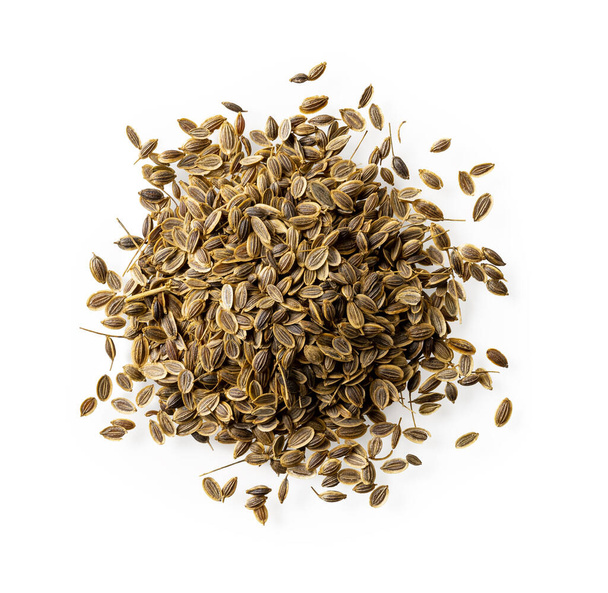 Heap of whole dill seeds isolated on a white background. Organic anethum graveolens fruits pile cutout. Natural spices, seasonings and condiments for cooking. Medicinal herb. Top view. - Photo, Image