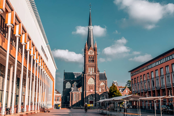Schiedam, Netherlands - OCT 8, 2021: Exterior view of the Basilica of St. Liduina and Our Lady of the Rosary, a neo-gothic Roman Catholic church in Schiedam, The Netherlands, built in the period 1878 - 1881. - 写真・画像