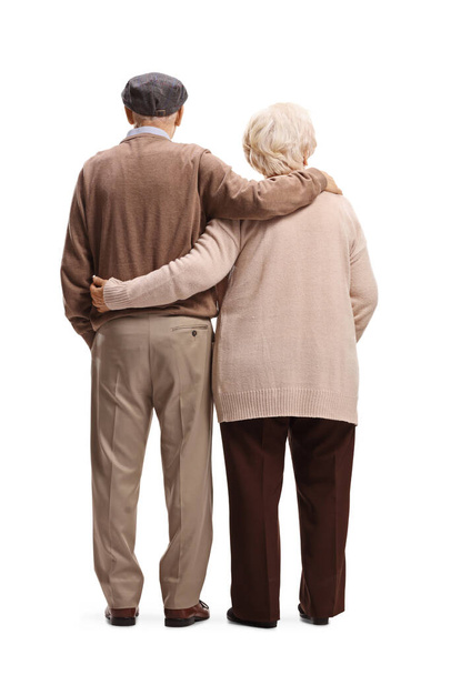 Full length rear shot of an elderly man and woman in embrace isolated on white background - Fotoğraf, Görsel