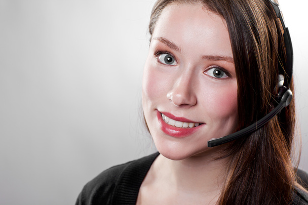 Businesswoman wearing a headset - Photo, Image