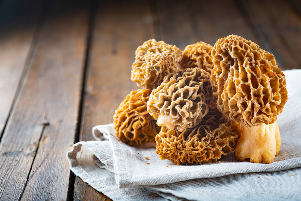 Morchella or morel edible mushrooms on the kitchen table - Photo, Image