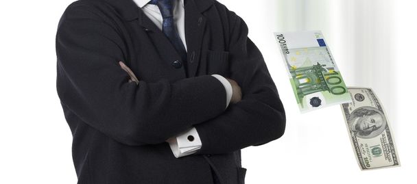 Financial executive with euro and dollar bills - Photo, Image