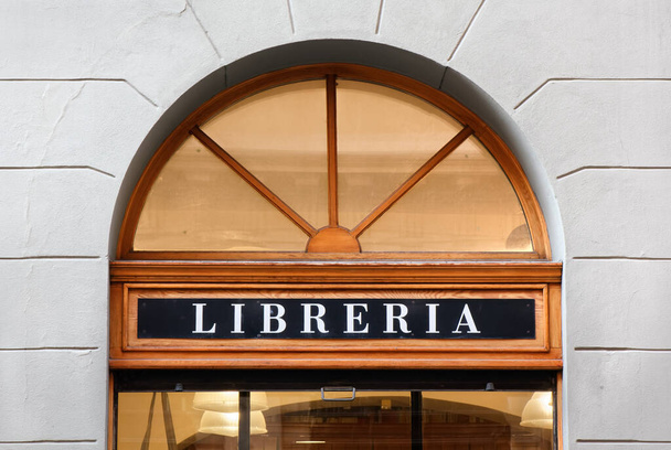 Elegant storefront sign of an Italian bookstore with cherry wood frames - Photo, Image