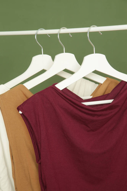Display of casual clothes made of organic cotton on clothing rack in fashion studio. - Zdjęcie, obraz