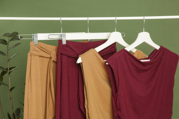 Display of casual clothes made of organic cotton on clothing rack in fashion studio. - Foto, Imagen