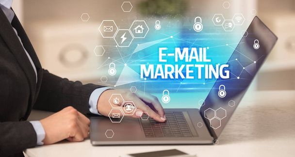 E-MAIL MARKETING inscription on laptop, internet security and data protection concept, blockchain and cybersecurity - Fotó, kép