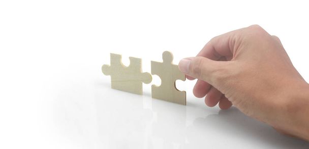 З'єднання головоломки в руці. Успіх бізнес рішень та концепція стратегії
 - Фото, зображення