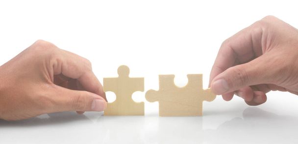 Connecting jigsaw puzzle in  hand. Business solutions success and strategy concept - Photo, Image