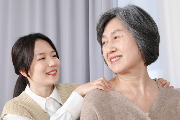 Asian Korean Family. Massaging - Фото, зображення