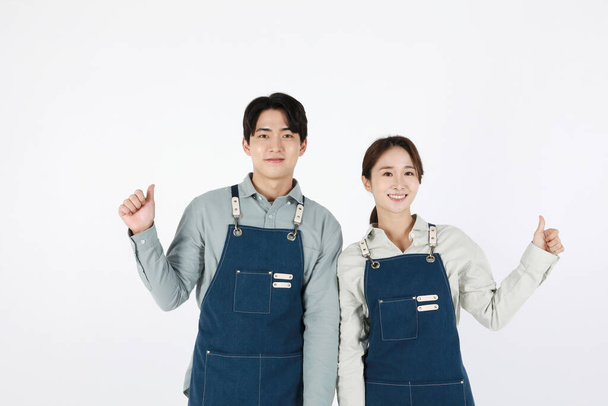start up concept asian korean young woman and man with hand motions - Zdjęcie, obraz