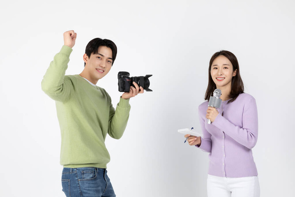 job interview preparation asian korean young woman and man, holding camera and microphone - Фото, изображение