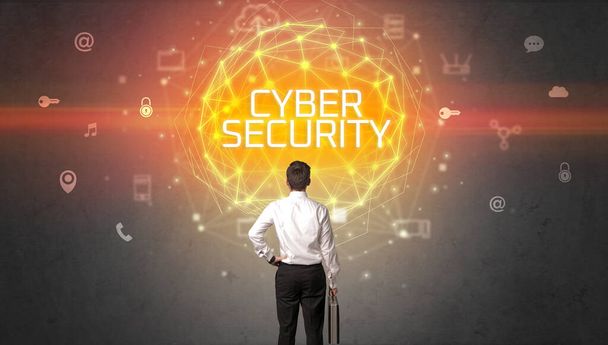 Rear view of a businessman with CYBER SECURITY inscription, online security concept - Photo, image