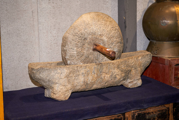 Large grinding stone grinding disc used in rural China - 写真・画像