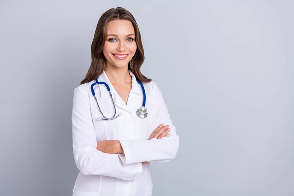 Photo of young pretty lady virology clinic arms crossed wear white lab coat isolated over grey color background - Foto, Bild