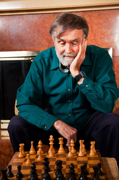 Senior man playing chess - Photo, Image