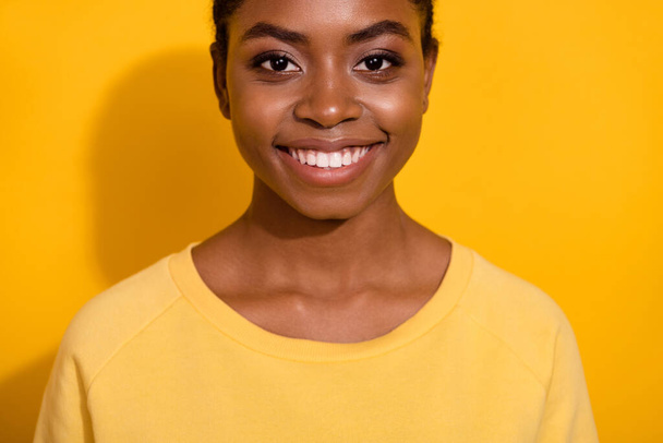 Cropped view portrait of attractive cheerful girl good mood isolated over bright yellow color background - Photo, Image