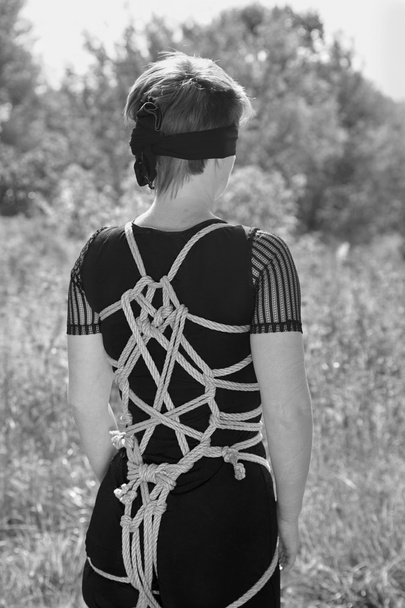 Bound woman with his hands tied and blindfolded. Shibari. - Photo, Image