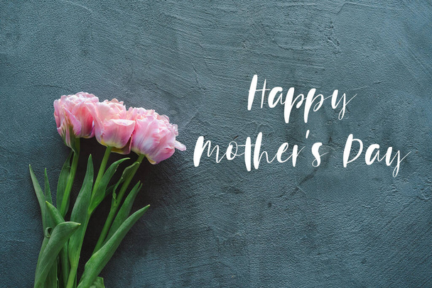 Happy Mothers Day. Fresh tulips flat lay on grey background - Фото, зображення