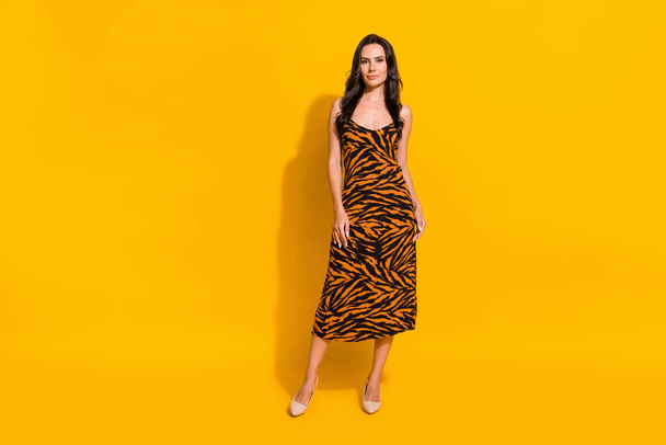 Full size photo of young adorable woman standing wear modern outfit isolated over yellow color background - Φωτογραφία, εικόνα