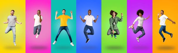 Carefree millennial guys of different races jumping up - Photo, Image