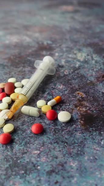 syringe and pills on dark background, close up  - Footage, Video