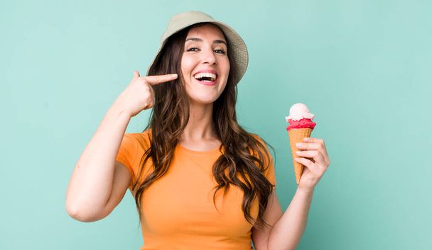 young pretty woman  smiling confidently pointing to own broad smile. summer and ice cream concept - Фото, зображення