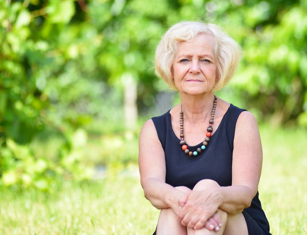 Mature woman in garden - Photo, Image