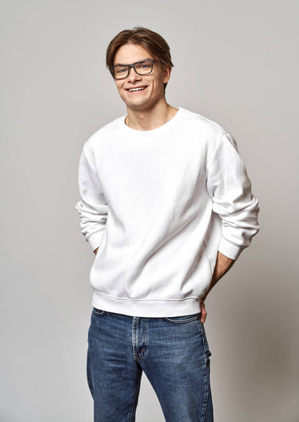 Portrait of young cheerful man wear daily outfit isolated over gray background - Photo, Image