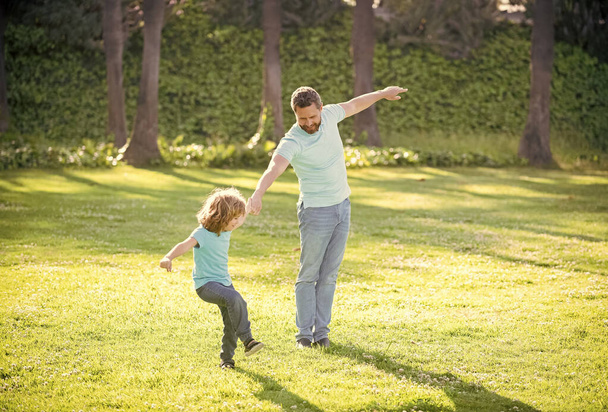 Enjoy every moment. Happy family enjoy summer outdoors. Playful father and son. Family fun - Фото, зображення