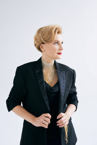 fashionable stylish beautiful mature woman in tuxedo.  - Valokuva, kuva