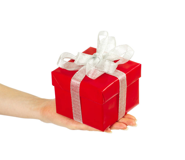 hand and gift over white background - Foto, imagen