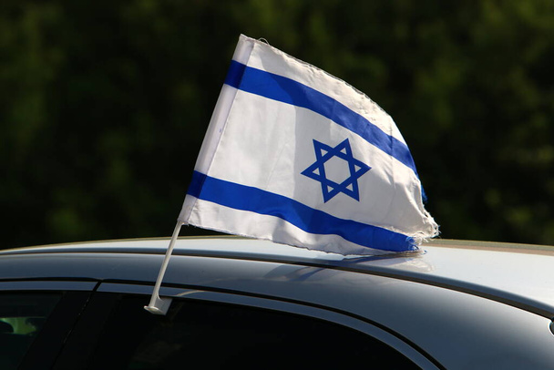 Israeli blue and white flag with the Star of David  - Фото, зображення