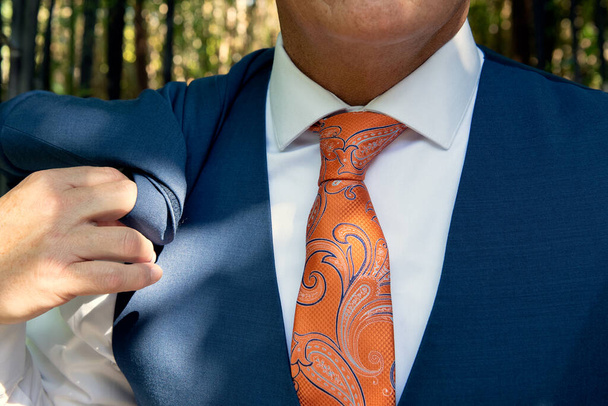 Sharp dressed man's tie is secured by a Windsor knot in stylish fashion. - Photo, Image