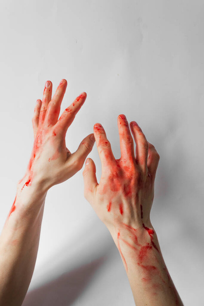 Bloody man hands isolated on white background. Hands of a murderer and a rapist. Halloween concept. - Photo, image