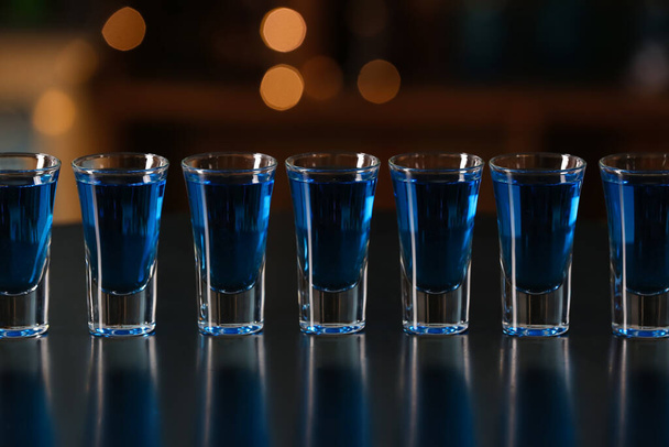 Shot cocktails on table in bar, closeup - Foto, imagen