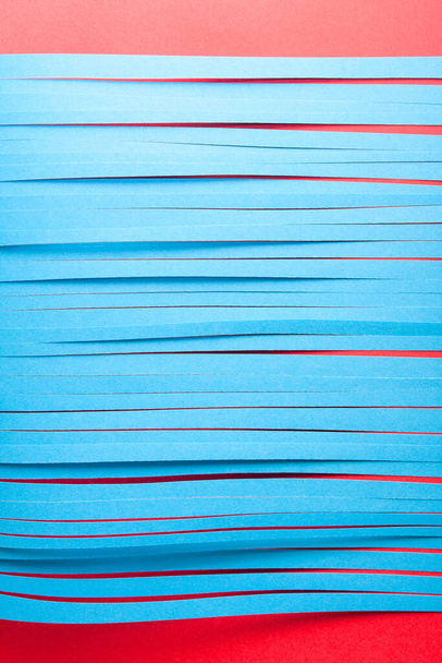 Blue cit paper strips background. Simple color paper background in blue and red. - Foto, immagini